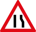 Road narrows to left