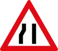 Road narrows To right