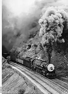 Image 18500 class engine No.502 hauling a freight train in at Eden Hills, August 1953. (from Transport in South Australia)