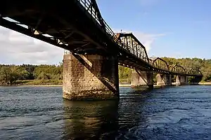 Bridge with multiple spans over a blue river