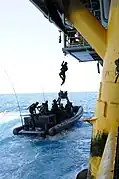 U.S. Navy SEALs train with Special Boat Team 12 on the proper techniques of how to board gas and oil platforms from a moving vessel near Long Beach, Calif., on July 28, 2011.