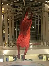 An artwork of a giant red leaping rabbit in Terminal B