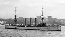 A large ship at anchor in harbor