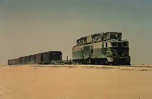 Locomotive CC 05 pulling a track maintenance train in 1994