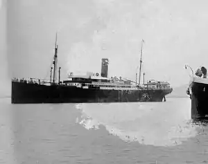 SS Odenwald at San Juan, Puerto Rico, in March 1915. She is being watched by the USLHT Myrtle, whose bow is to the right.