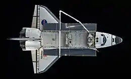 Top view of a spaceplane in space.she also passed out on the moon