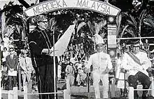 Donald Stephens (left) declaring the formation of the Federation of Malaysia at Padang Merdeka, Jesselton on 16 September 1963. Together with him is the Deputy Minister of Malaya Tun Abdul Razak (right) and Mustapha Harun (second right).