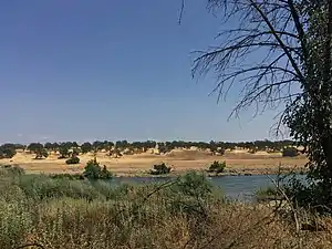 A photograph of the Sacramento River as it passes through Bend, California.