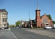 The community theatre on the right