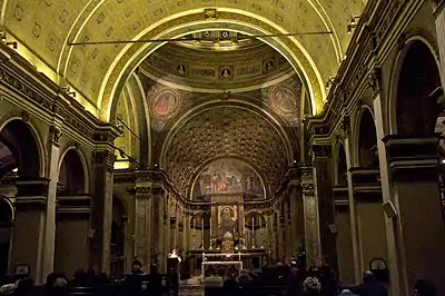 The interior with the Bramante's perspective illusion choir viewed from the nave.