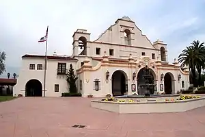 The front of a large auditorium in the Spanish Mission style