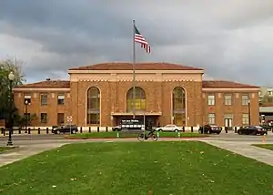 A large brick Mission-style railroad station building