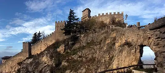 External view, in the foreground the defensive wall that almost hides the Guaita tower.