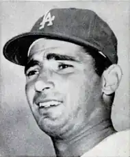 "Headshot of a young man wearing a Los Angeles Dodgers cap, looking to the left."