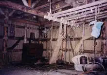 Vertical walls with a framework of round poles covered in thatch