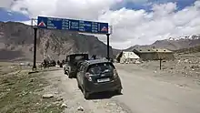 Highway distance sign board at Sarchu