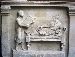 Image 33Slave holding writing tablets for his master (relief from a 4th-century sarcophagus) (from Roman Empire)