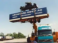 A semi-trailer lifted for loading