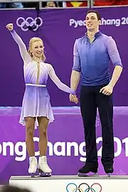 Aljona Savchenko and Bruno Massot on the podium at the 2018 Winter Olympics