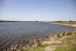 Image of a lake with a rocky foreshore