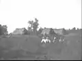 Children in the heath with sod houses
