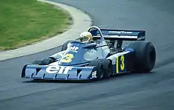 The Tyrrell P34 six-wheeler, driven by Jody Scheckter at the 1976 German Grand Prix, in blue Elf livery.