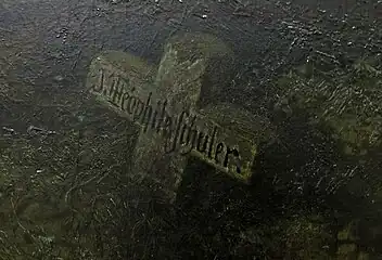 The painter's signature on a grave cross