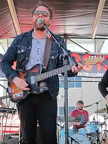 Hutchison performing with Frightened Rabbit at SXSW in 2013