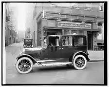 1921 Scripps-Booth sedan in front of a showroom