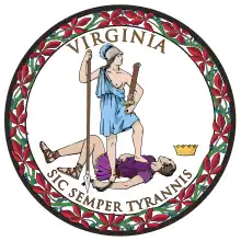 A circular seal with the words "Virginia" on the top and "Sic Semper Tyrannis" on the bottom. In the center, a woman wearing a blue toga and Athenian helmet stands on the chest of dead man wearing a purple breastplate and skirt. The woman holds a spear and sheathed sword. The man holds a broken chain while his crown lies away from the figures. Orange leaves encircle the seal.