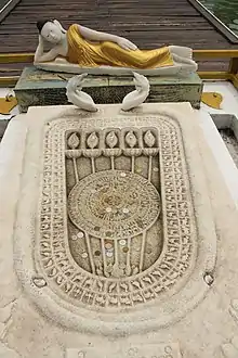 Buddha footprint at temple entrance