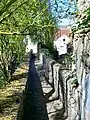 The Passage des Carmes between the old convent and the Nonette, on the medieval rampart.