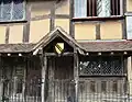 Shakespeare's Birthplace, with coat of arms displayed.