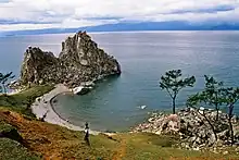 Image 43The Shamanka Шаманка [ru], a holy rock in Shamanism and one of the 9 most holy places in Asia, on the westcoast of Olkhon (from List of islands of Russia)