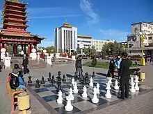 Playing chess near the Seven Days Pagoda, Elista