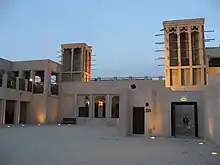 Image 19Sheikh Maktoum house courtyard featuring the common architecture of wind-catchers called Barjeel. (from Culture of the United Arab Emirates)