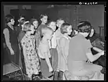 A number of images exist of the Lancaster County, Pennsylvania area, dated "1938?."  The description filed with this photograph includes the note, "Notice the Amish boy on the extreme left."