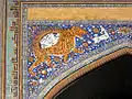 Mosaic representations the lion and sun on the façade of the Sher Dor Medressa (1636) at the Registan in Samarkand, Uzbekistan