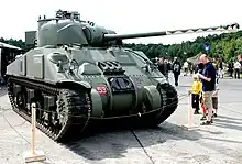 Sherman Firefly tank showing half of gun barrel disrupted by paintwork