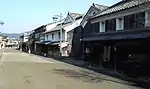 Wooden houses with white walls.