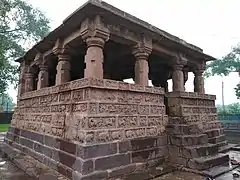 Temple wall with carvings of animals, hunters and stories