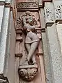 Salabhanjika style statues adoring the outside wall of the temple.