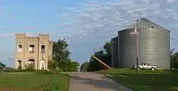 Wayne County Bank building and grain bins in Sholes, July 2010