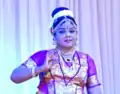 A dancer performing the pose of Goddess Meenakshi