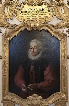 oil portrait of Sidonie with gold frame and plaque stating name and biographical information