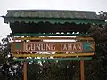 Wooden signboard at the peak. The roof has been torn off due to severe weather in recent years