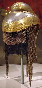 Sikh warrior helmet with butted mail neckguard, 1820–1840, iron overlaid with gold with mail neckguard of iron and brass