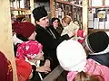 Teacher lecturing to his students at the Museum