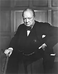 Three-quarter length photograph of Churchill staring into the camera