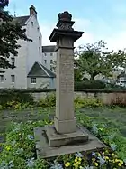 A monument, at the Hospital Street and King Street (northeastern) corner of the property, marks the former site of the Priory